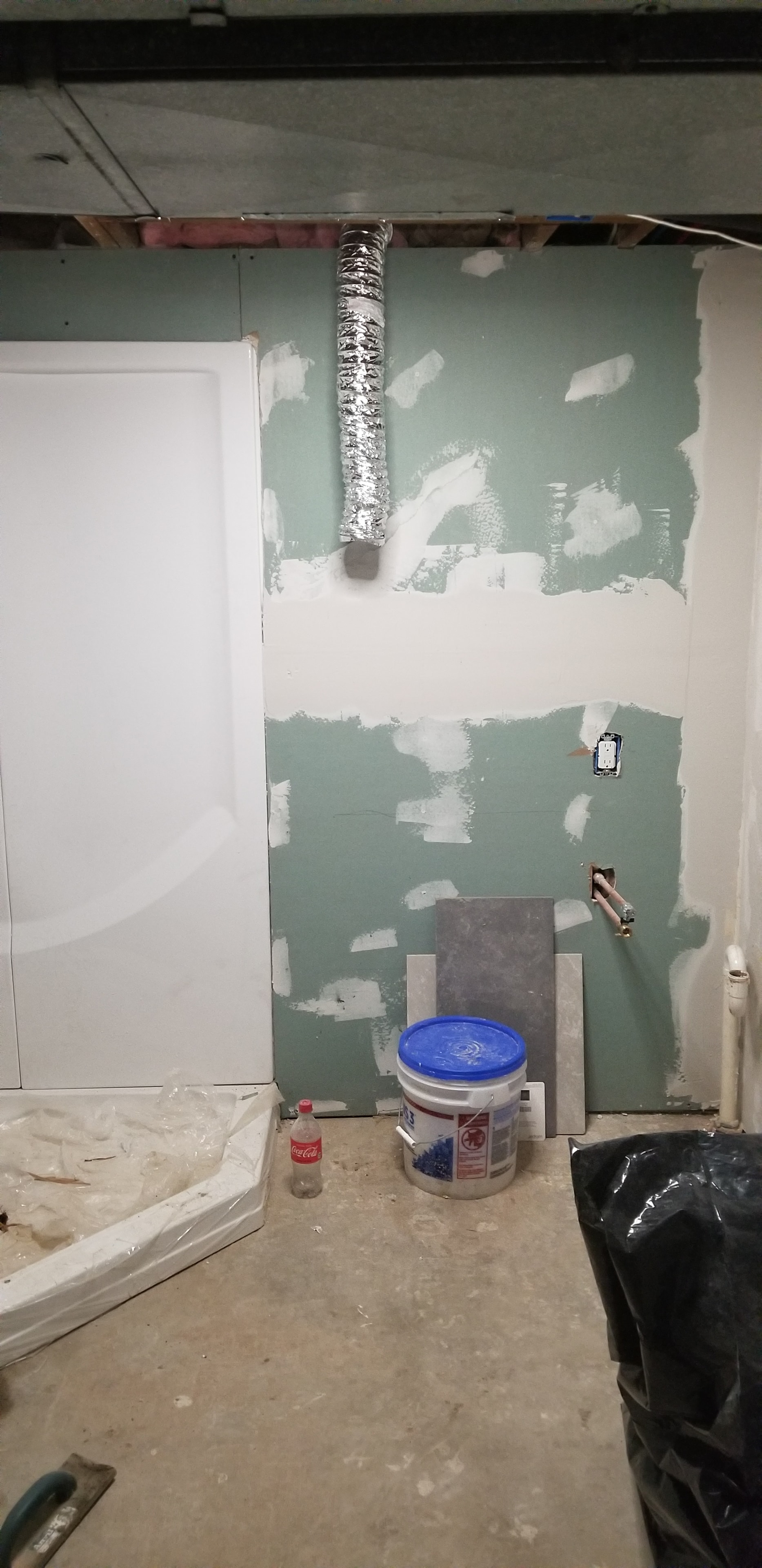 Bathroom renovation — bathtub set and drywall mudding