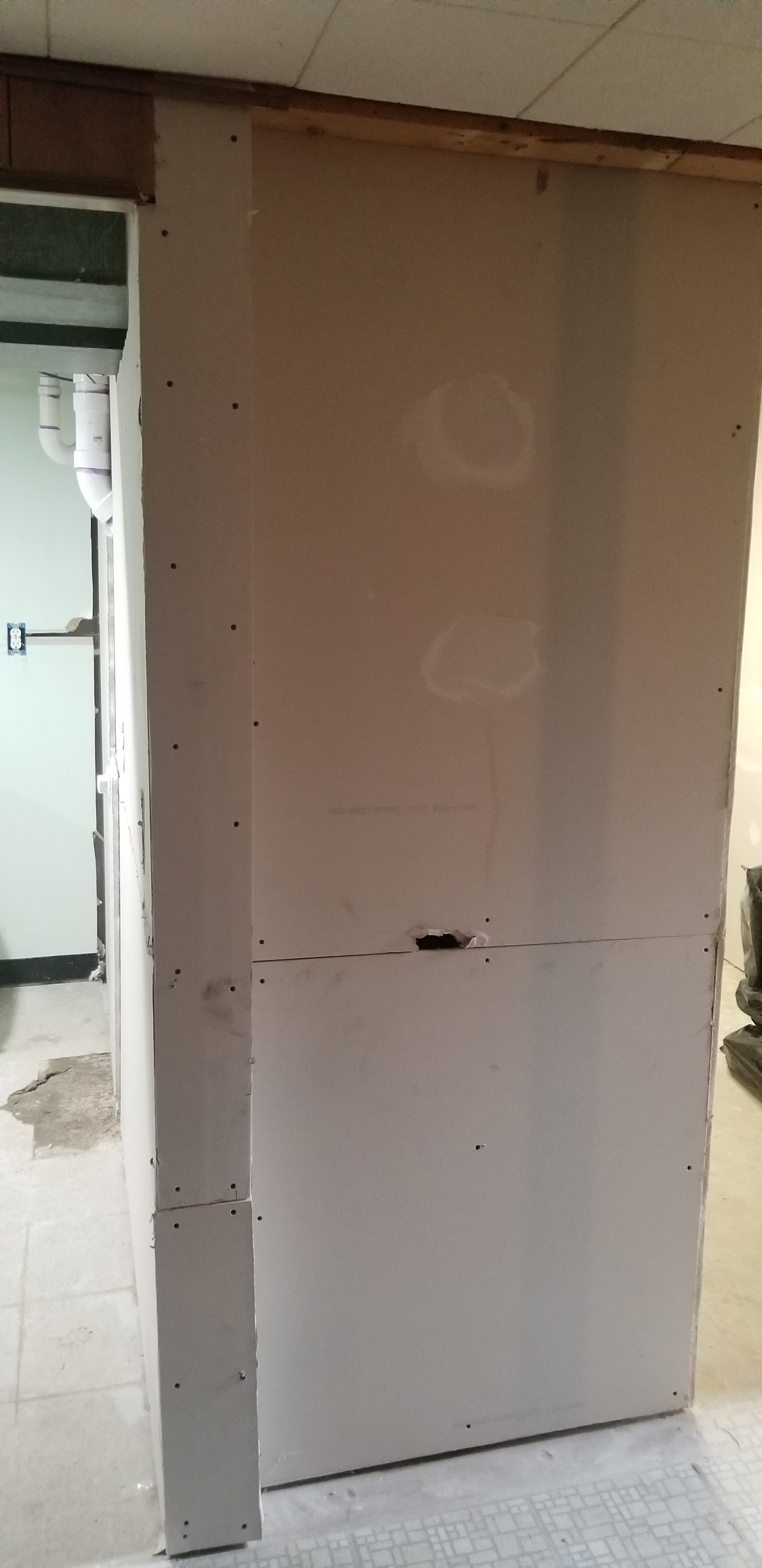 Bathroom renovation — drywall installation in progress