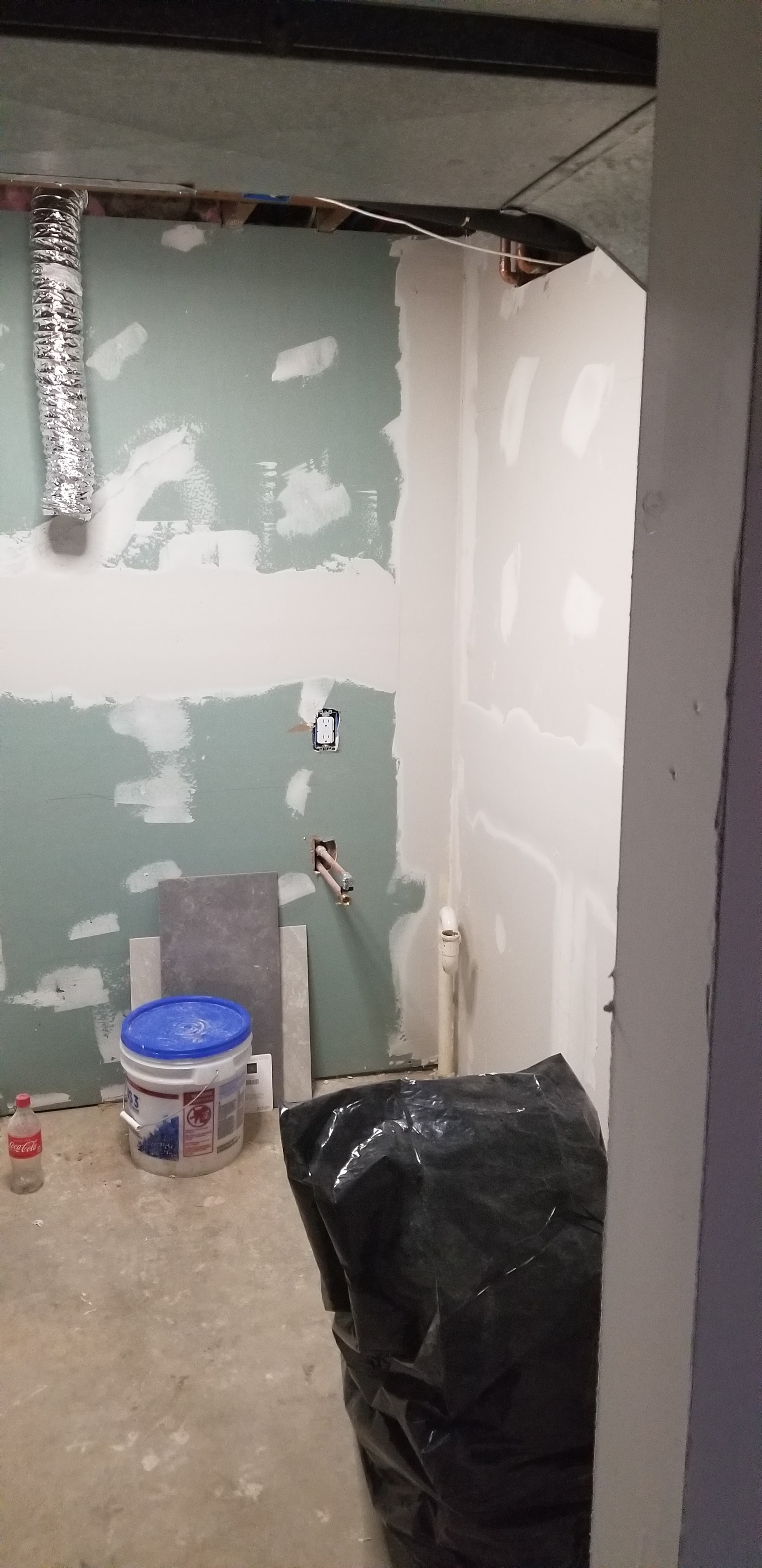 Bathroom renovation — greenboard and plumbing rough-in